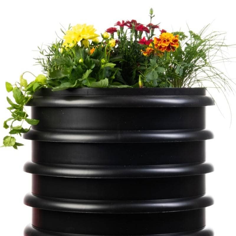 WORMbox wormery with its flower-filled planter in place of the lid